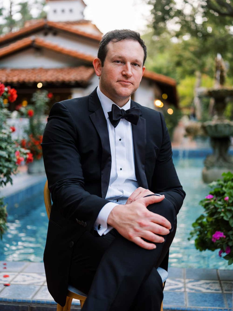 Rick Hale poses before playing at a luxury wedding at a California venue.